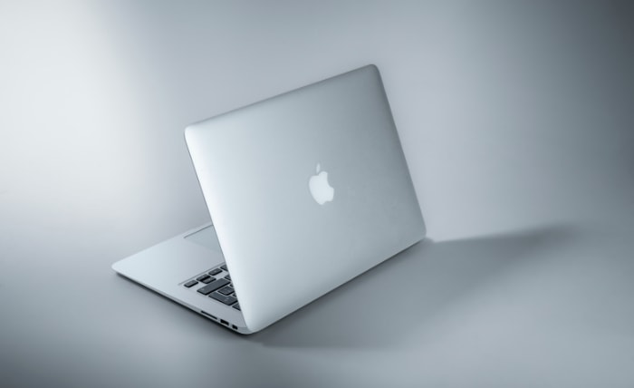 Macbook on white surface