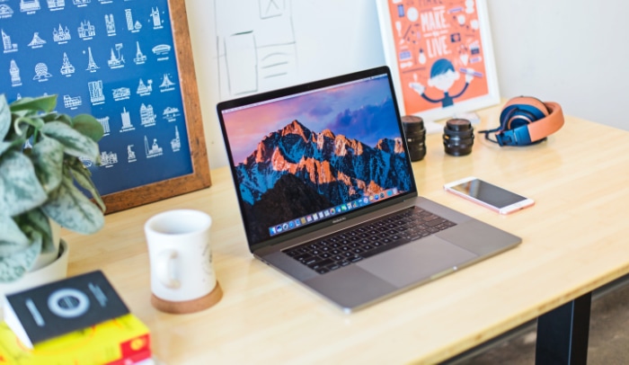 Macbook on wooden desk