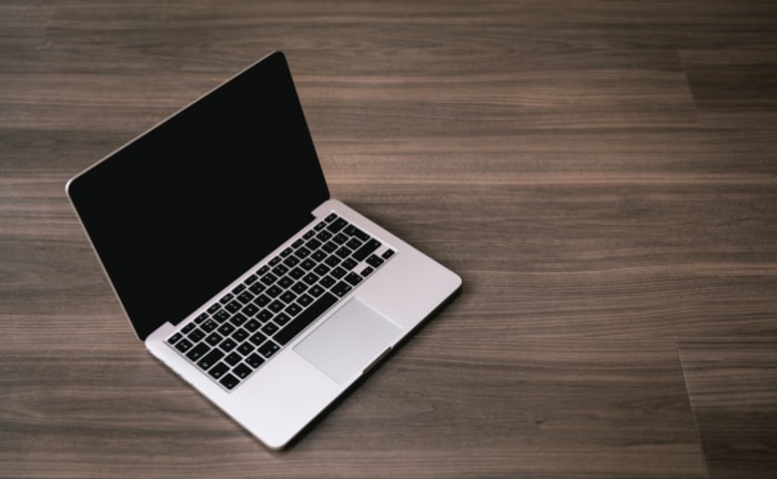 Macbook on wooden floor