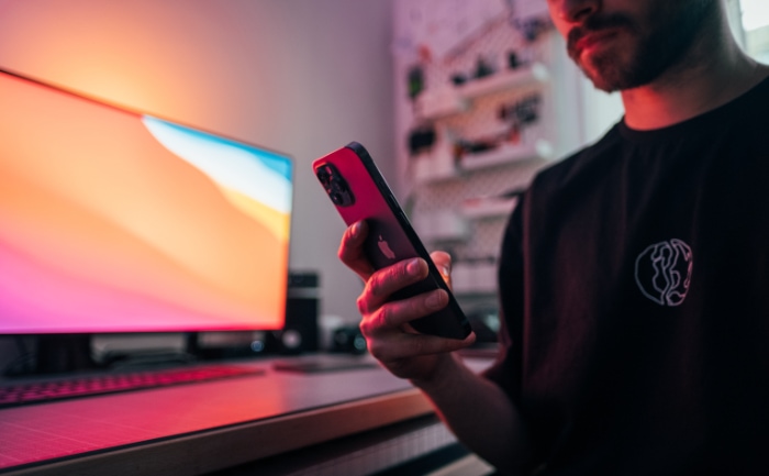 Man holding black iPhone