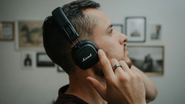 Man listening to Marshall headphones