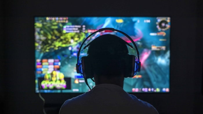 Man playing online game with headphone