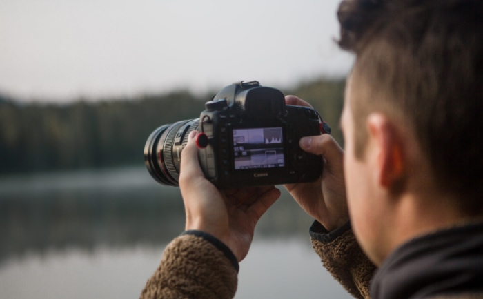 Man using canon DSLR camera