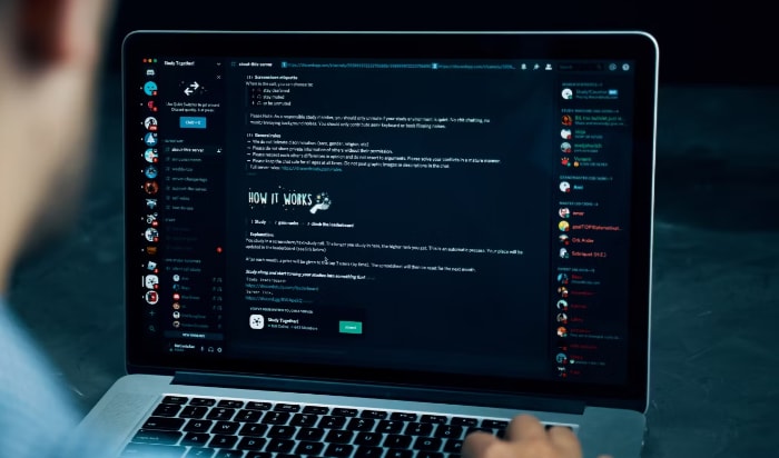 Man using discord on laptop
