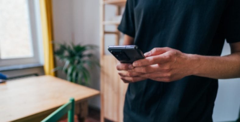 Man using black smartphone