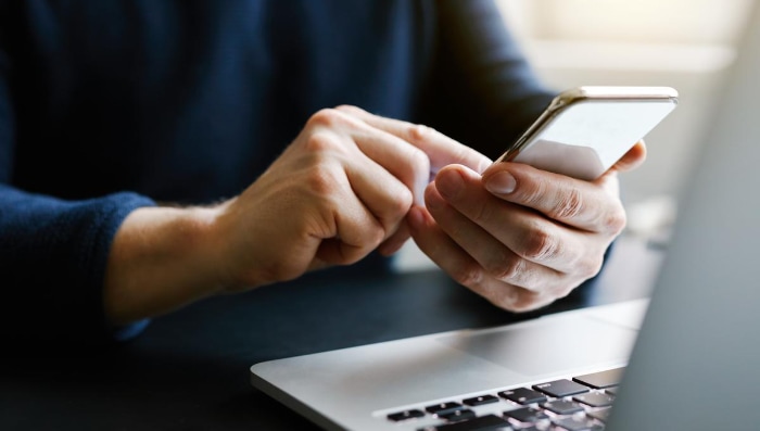 Man using white smartphone