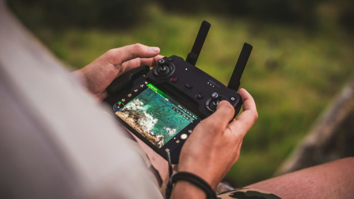 Mavic Air remote controller showing live aerial footage