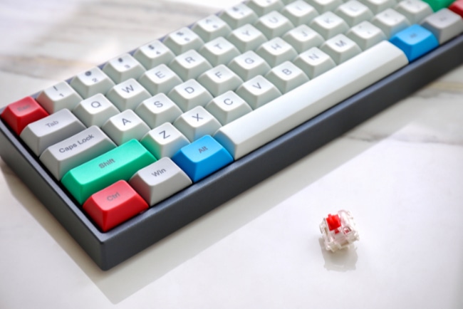 Mechanical keyboard's red switches on white surface