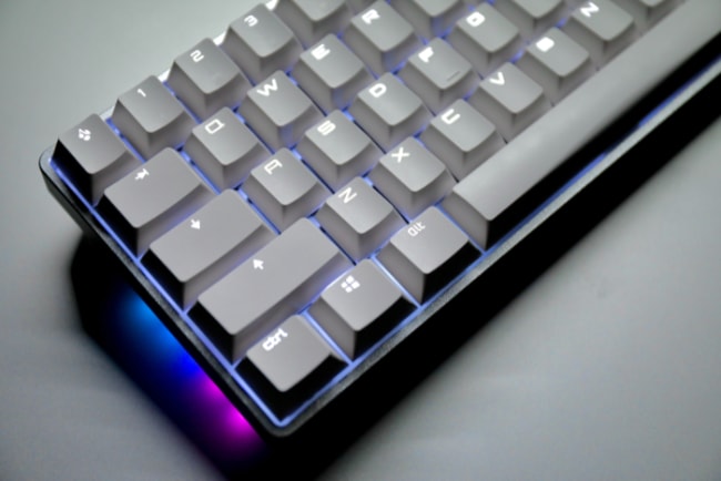 Mechanical keyboard with light on gray surface