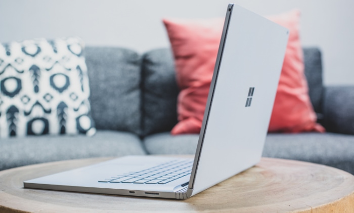 Microsoft Surface laptop on a wooden table