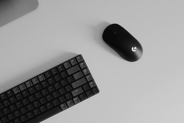 Minimalist black keyboard and mouse on a desk