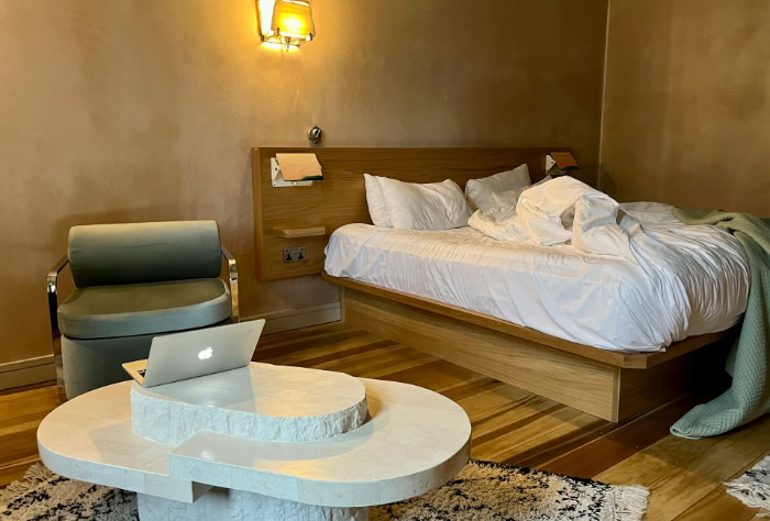 Modern hotel room with laptop on table