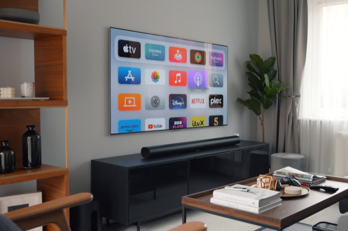 Modern living room with Apple TV home screen interface