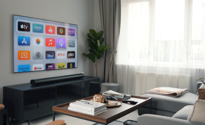 Modern living room with wall mounted TV and soundbar