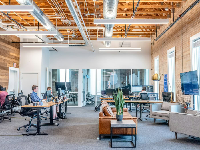 Modern loft office with standing desks and lounge resized