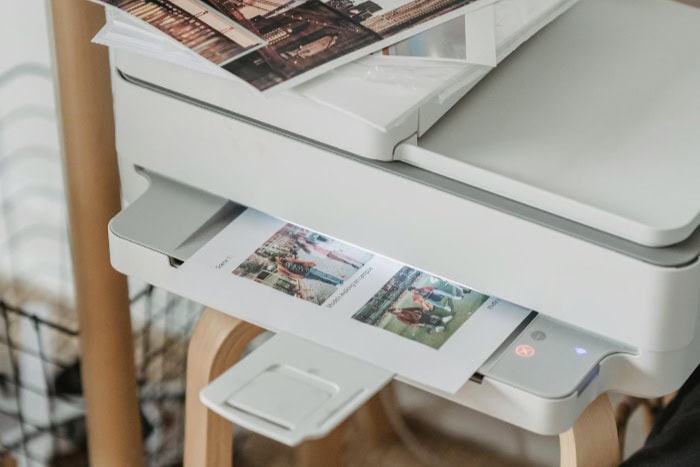 Modern printer with printed photographs