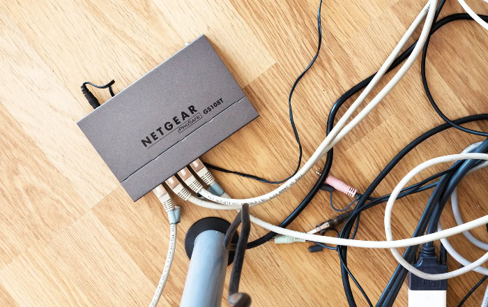 Netgear network switch with multiple Ethernet cables connected