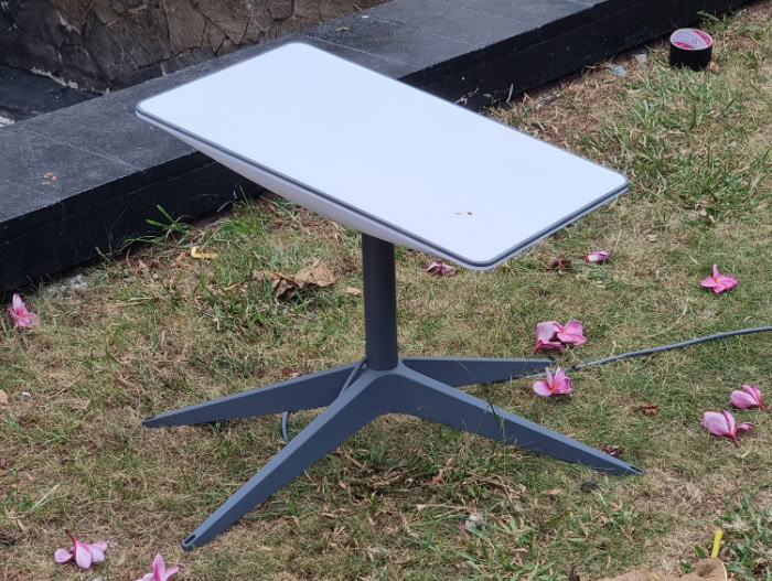 Newer rectangular Starlink dish standing on grass