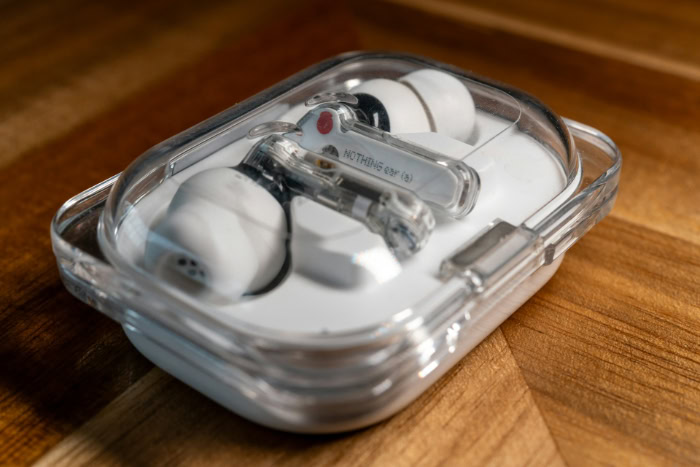 Nothing Ear earbuds inside transparent charging case