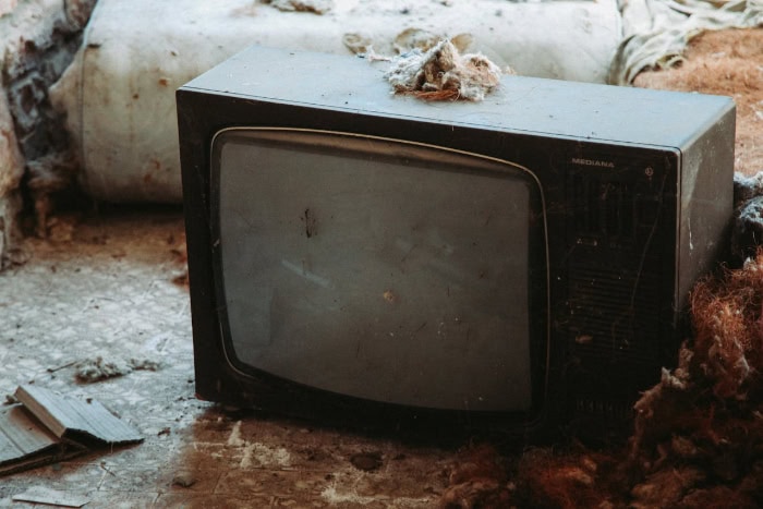 Old Mediana CRT television abandoned on dusty floor