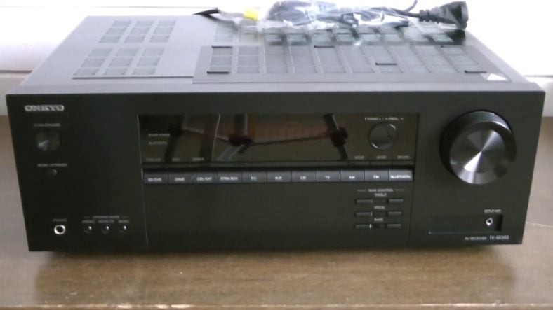 Black Onkyo TX-SR393 on wooden table