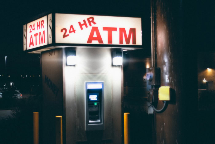 Outdoor 24 hour ATM machine at night