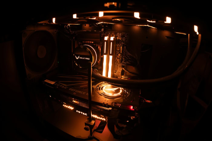 PC interior with orange lighting and AIO cooler