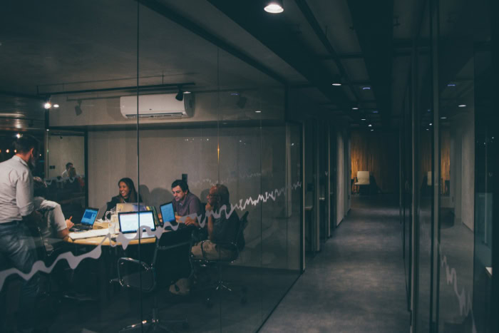 People collaborating in modern office conference room