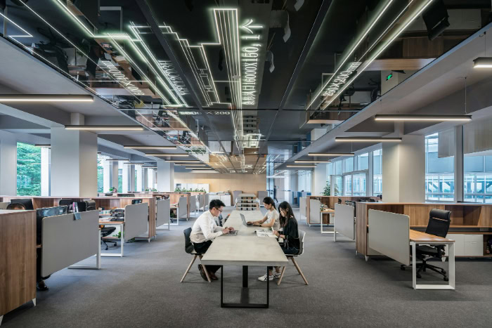 People working on laptops in modern spacious office resized
