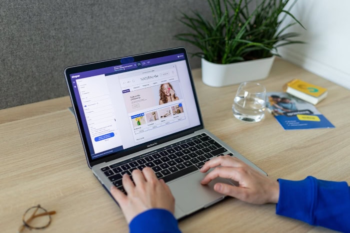 Person browsing an e commerce website on a laptop