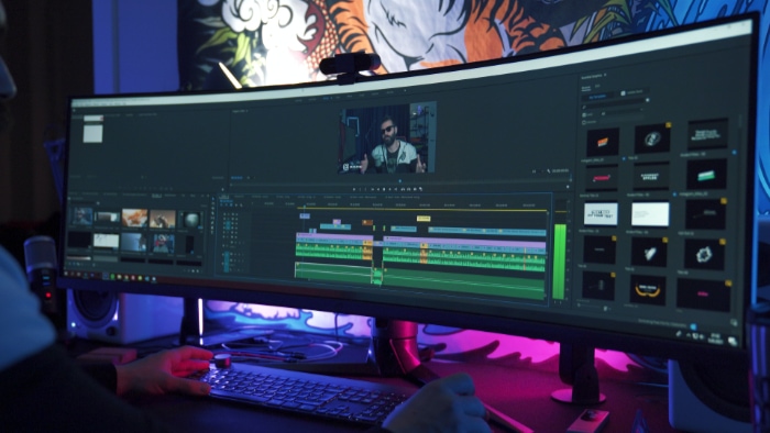 Person editing video on adobe premiere