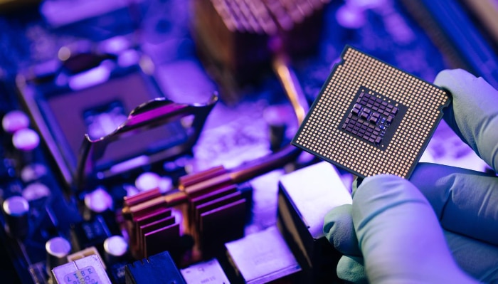 Person holding Intel CPU 2