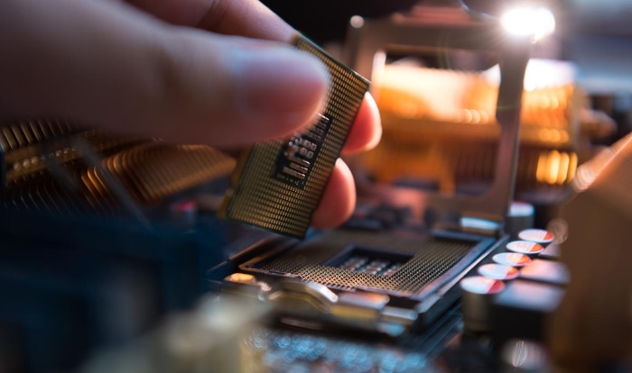 Person holding Intel CPU