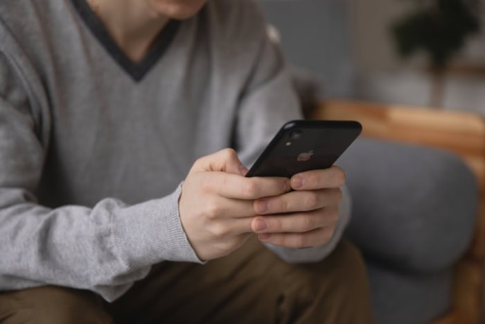 Person holding a smartphone while