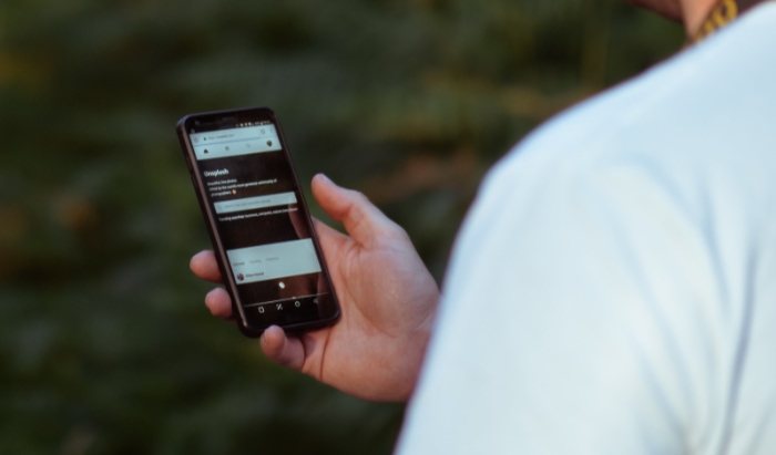 Person holding black smartphone