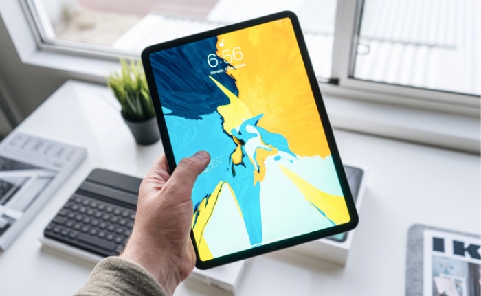 Person holding iPad pro