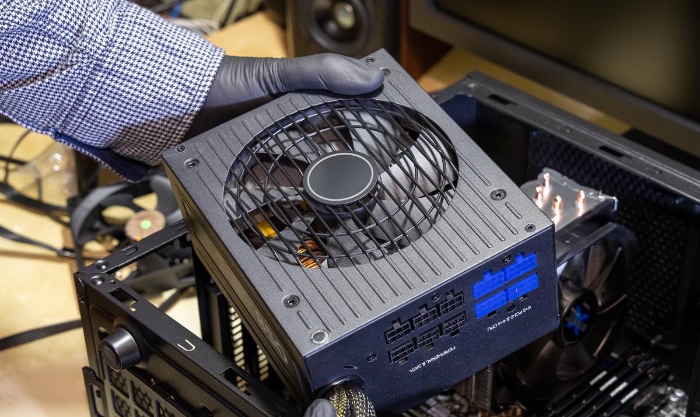 Person holding power supply unit