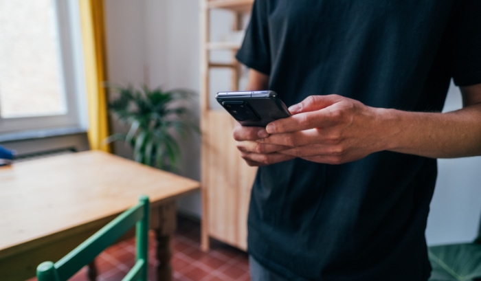 Person holding black smartphone