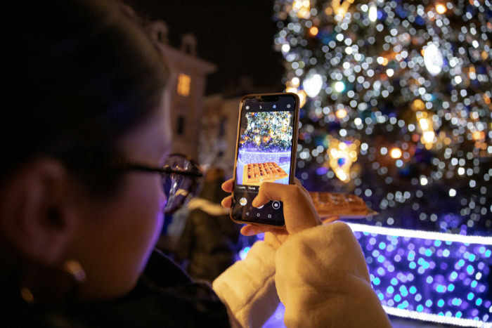 Person taking photo of food with smartphone