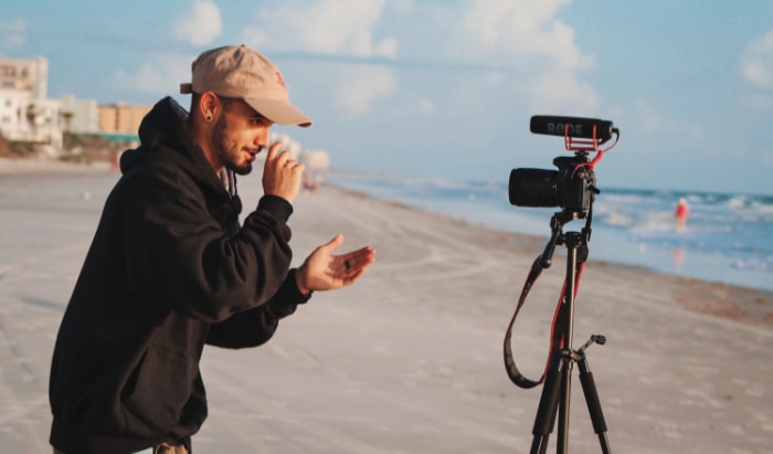 Person talking to camera on the beach