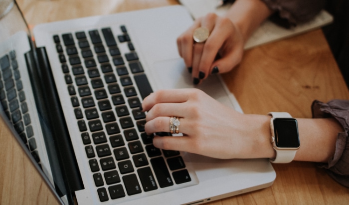 Person using silver macbook