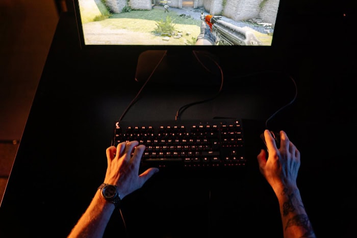 Person using a keyboard and mouse during gameplay 1