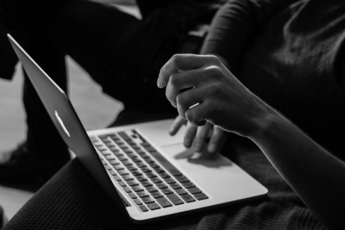 Person using a laptop in a low light setting