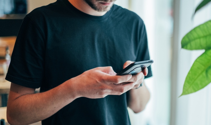 Person using black smartphone