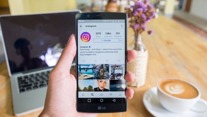 Person using instagram app on smartphone
