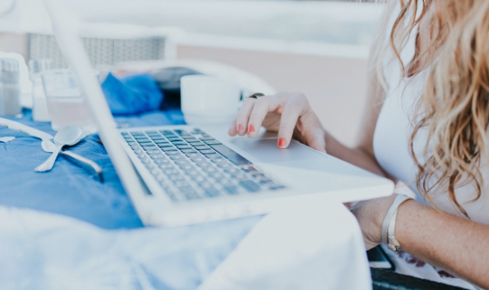 Person using laptop on table