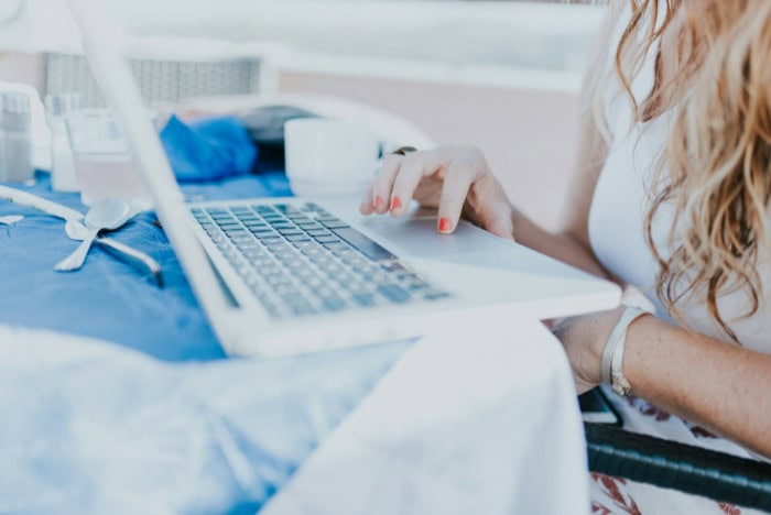 Person using white laptop