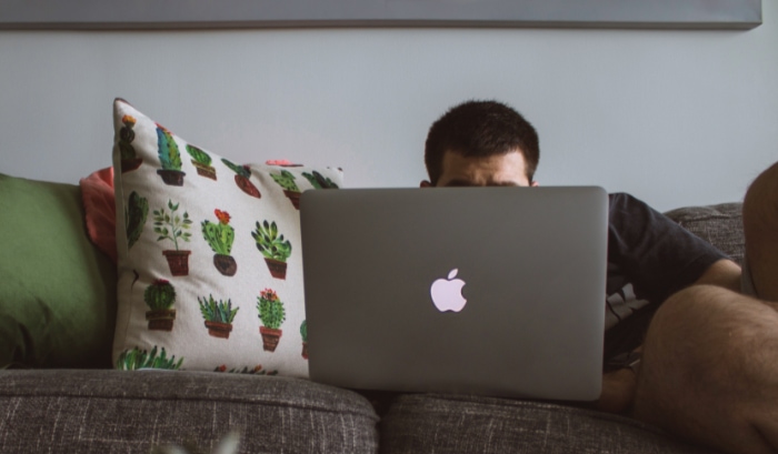 Person watching video on macbook