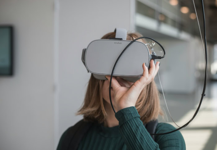 Person wearing Oculus VR headset indoors