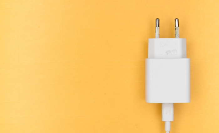 Phone charger on yellow background